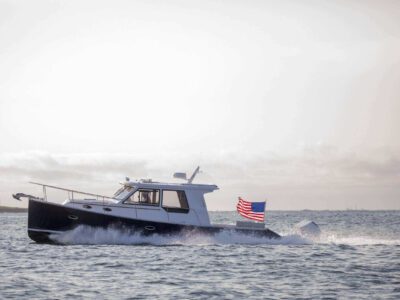 True North 39 underway with flag flying at stern