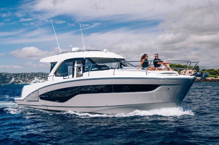 Antares 11 Coupe with couple on deck
