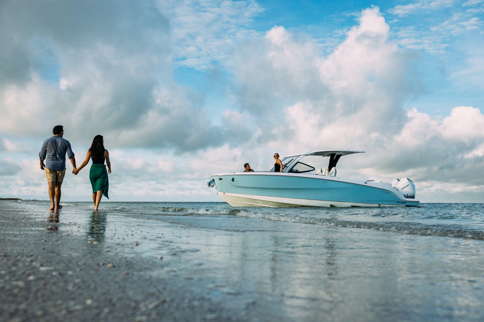 Flyer 30 hovering coast line with couple walking on the beach