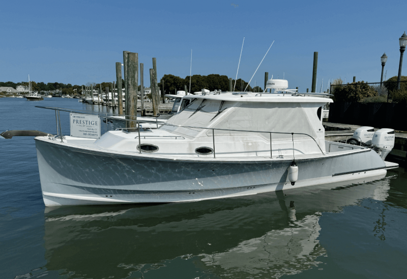 True North 34 with PYS for sale sign in water